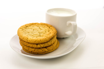 plain sugar cookies and cup of milk