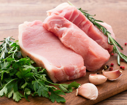 Raw pork meat on wooden desk
