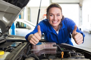 Mechanic smiling at the camera