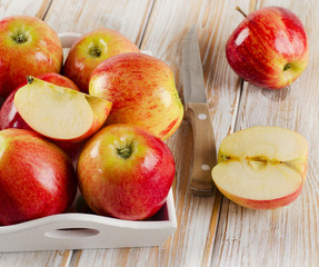Naklejka na ściany i meble Fresh apples in a wooden white box .