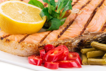 Fototapeta na wymiar Grilled salmon steak with vegetables