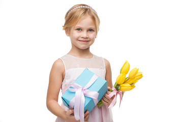 Beautiful girl holding yellow tulips and blue present box
