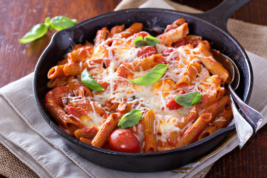 Pasta bake with penne, tomatoes and mozarella