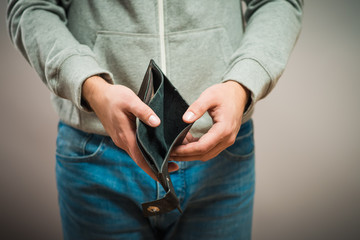 Bankruptcy - Business Person holding an empty wallet