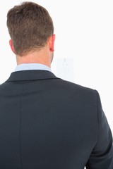 Focused man in suit on eye test letters