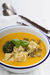 Pumpkin cream soup with cheese tortellini