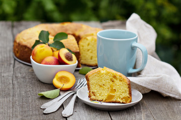Freshly baked peach cake with tea