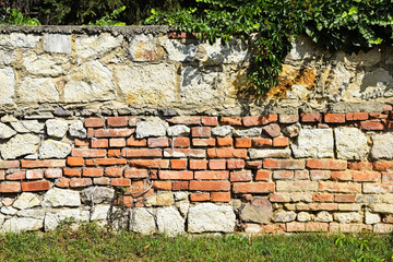 Old ruined brick and stone wall