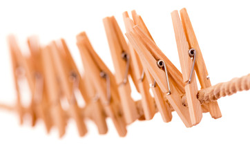 wooden clothespins hanging on rope