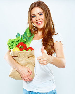 Smiling Happy woman hold green vegan food.