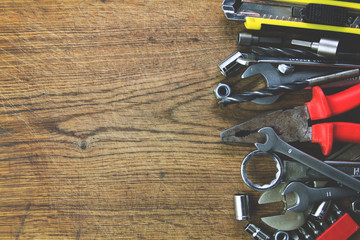 set of tools on wood board background