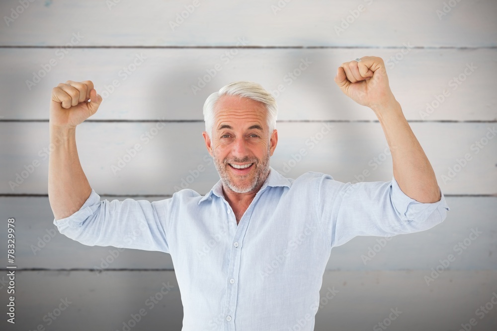 Poster Composite image of smiling man cheering at camera