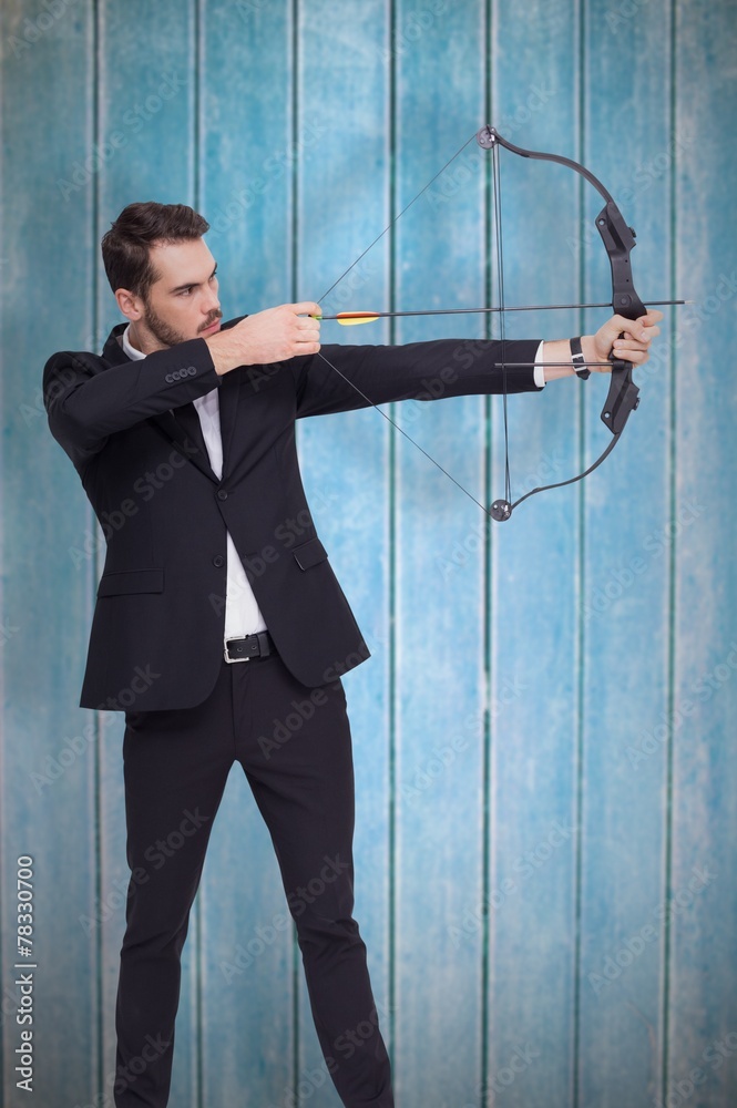 Poster composite image of businessman shooting a bow and arrow