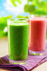 Summer drink, green and pink smoothies, outdoor