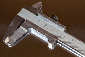 Photo of steel calliper and it's reflection