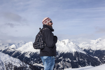 Fototapeta na wymiar Young man enjoys the view in the mountains