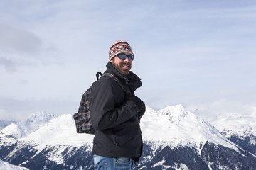 Fototapeta na wymiar Young man enjoys the view in the mountains