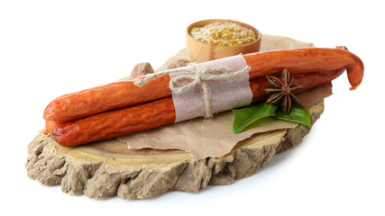 Smoked thin sausages, mustard in bowl and spices