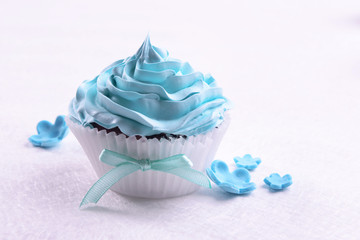 Delicious cupcake on table close-up