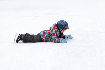 Fototapeta na wymiar Child lying on the rink