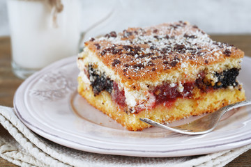 Homemade pie with jam and glass of milk