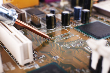 Fototapeta na wymiar Repairing of computer motherboard, macro view