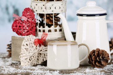 Winter composition with hot beverage on nature background