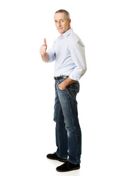 Mature man gesturing ok sign