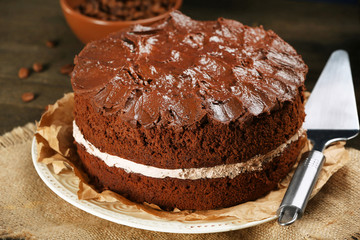 Delicious chocolate cake on table close-up