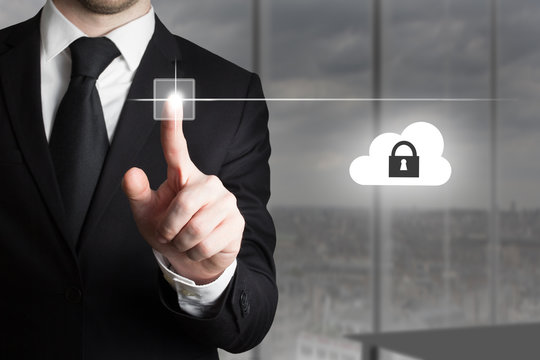 businessman pushing touchscreen button cloud security