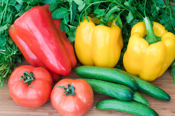 Fototapeta na wymiar Vegetables peppers, tomatoes, cucumber, parsley, mint.