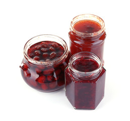 Fototapeta na wymiar Homemade jars of fruits jam isolated on white background