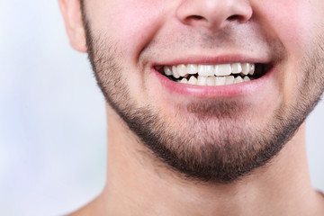 Smiling young man after visit dentist