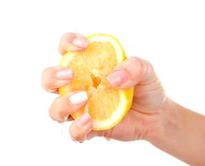 Female hand squeezing lemon isolated on white