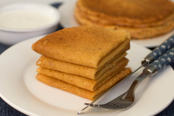 Pancakes on a white plate