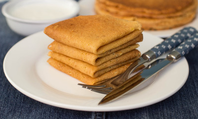 Pancakes on a white plate