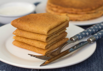 Pancakes on a white plate