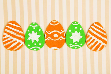 Felt Easter eggs on craft paper background
