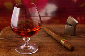 alcohol and cigar on a wooden table