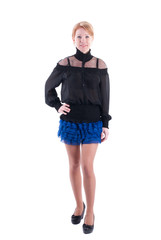 Woman in dress standing on a white background.