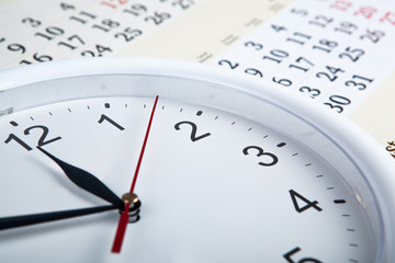 sheet of a calendar with clockface