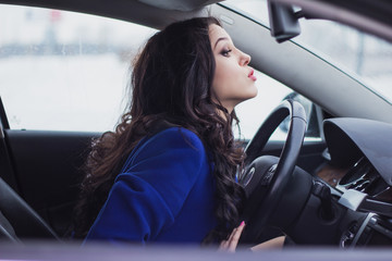 woman trying to drive around an obstacle on the road