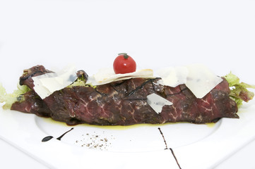 carpaccio with herbs and cheese on white background
