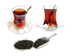 Turkish tea in traditional glass and dry black tea leaves .
