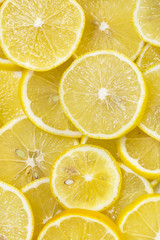 background of sliced ripe lemons