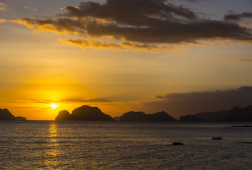 Naklejka na ściany i meble sunset in the Philippines in the area of El Nido