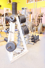 Fototapeta na wymiar Barbel weights in gym