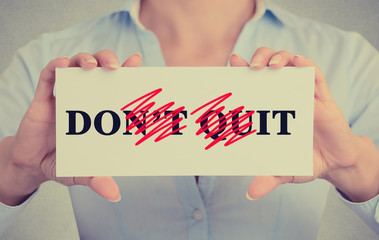 Closeup woman hands holding sign don't quit do it message