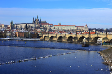 Snowy Prague gothic Castle with Charles Bridge, Czech Republic