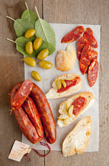 italian spicy sausage, Bruschetta, sage leaves, green olives, fr